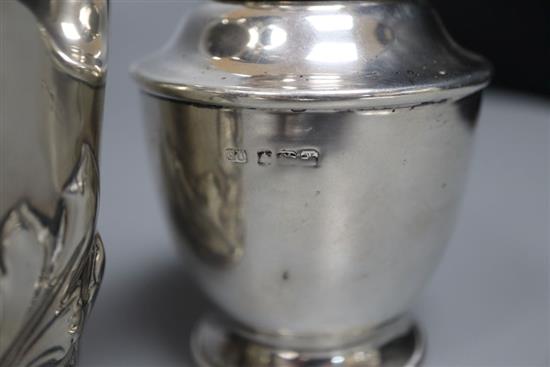 A George V silver tea caddy by George Unite & Sons, 10.7cm and a silver water jug,
